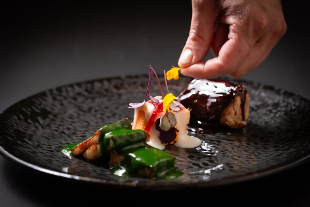 Finishing a dish in the Cuculia kitchen