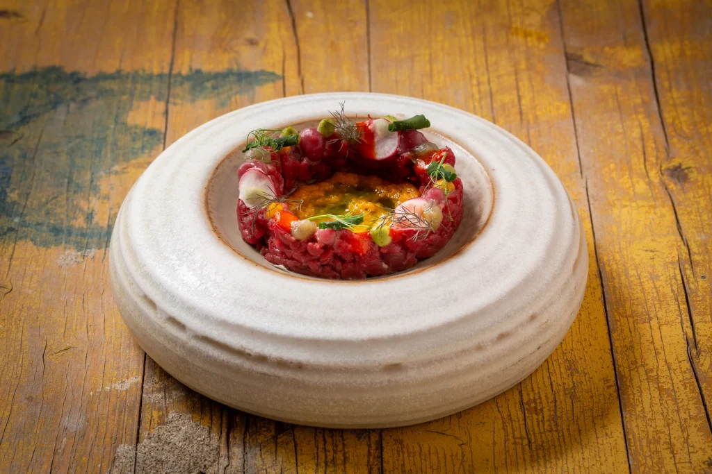 A Cuculia creation on a handcrafted ceramic plate