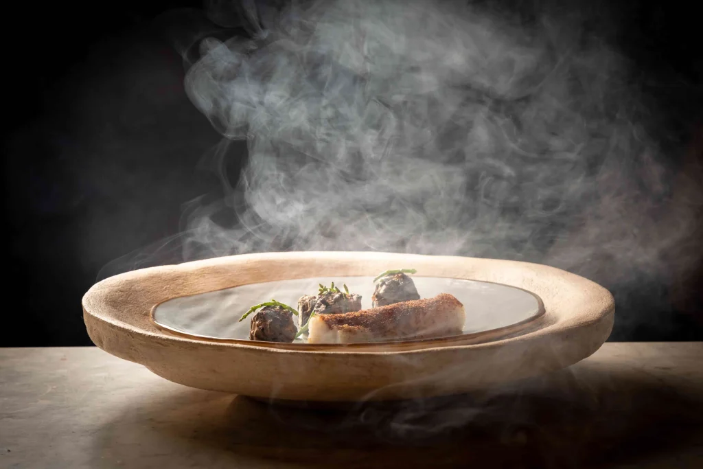 Monkfish served in a steaming bowl